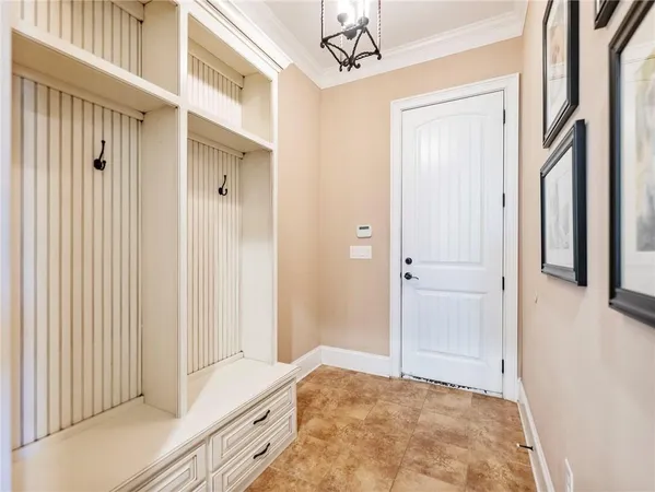 a view of an empty room with a fireplace and a window