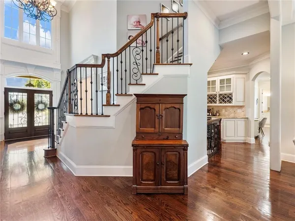 a bedroom with a bed couch and a window