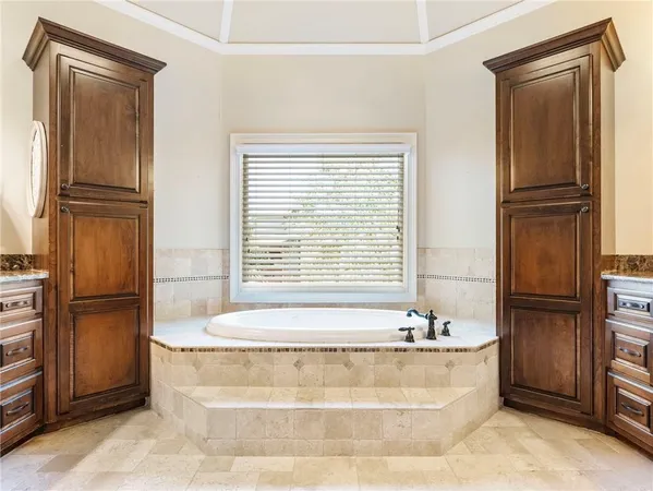 a view of a chair and table in backyard of the house
