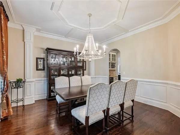 a living room with fireplace furniture and a wooden floor