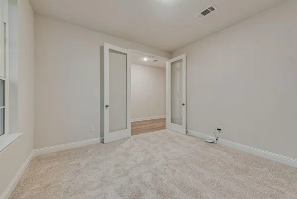 an empty room with windows