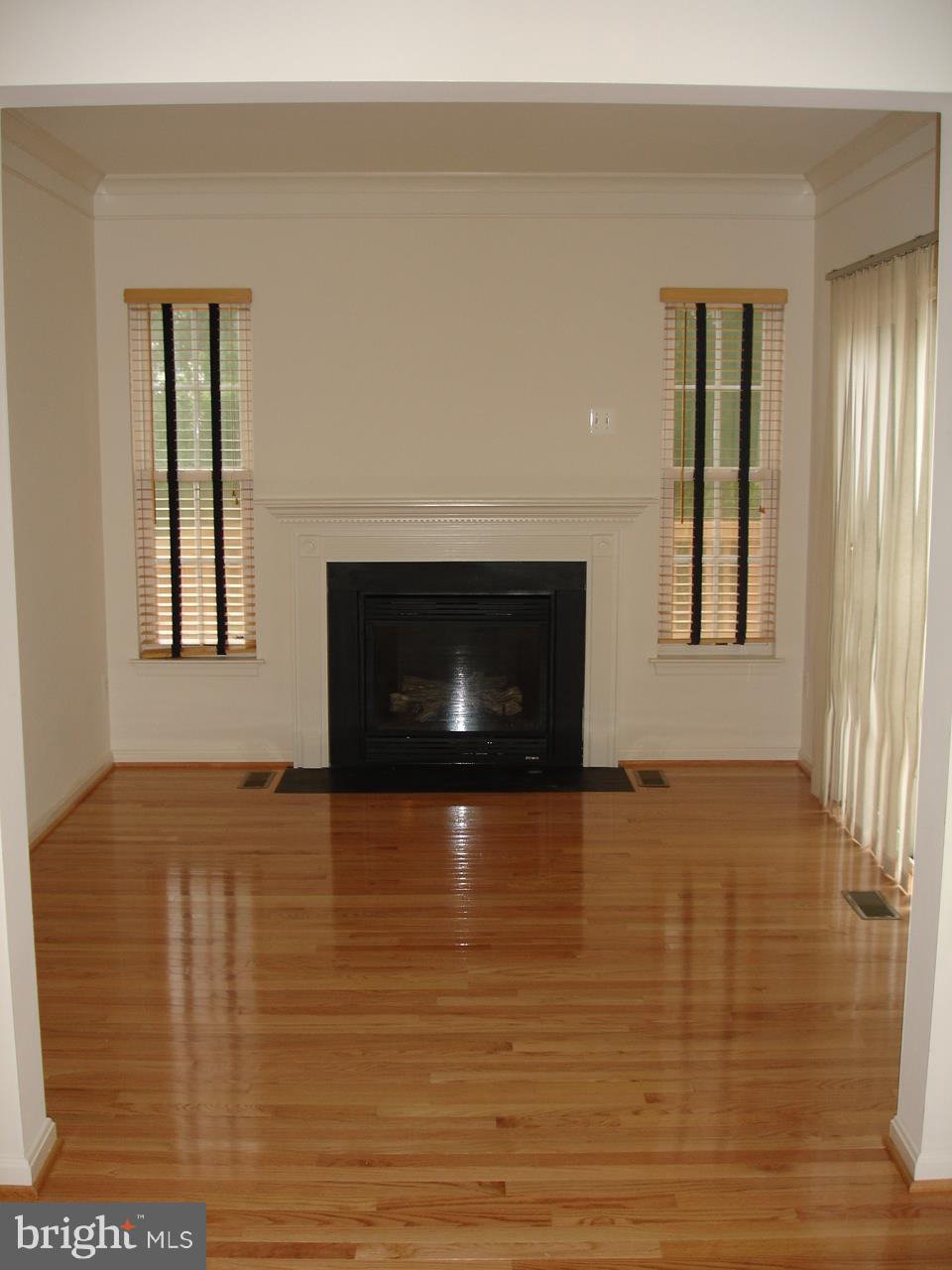 9060 Two Bays Road Lorton, VA 22079 - Photo 12 of 30 Hardwood Floor Sun Room with Fireplace