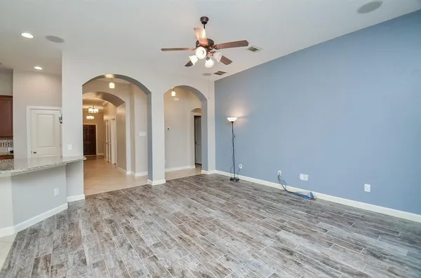 a view of a hallway with a chandelier