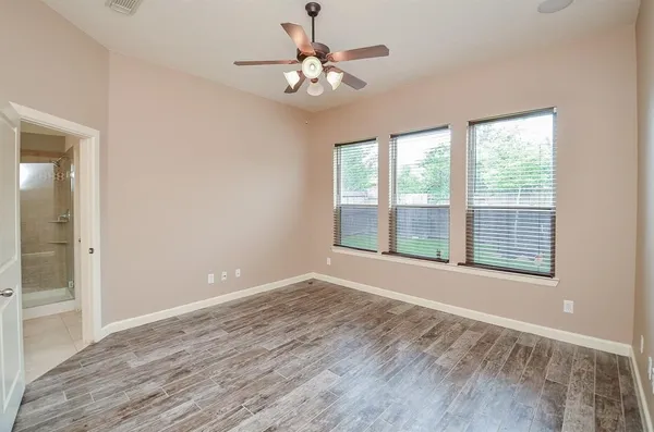 a view of an empty room with a window