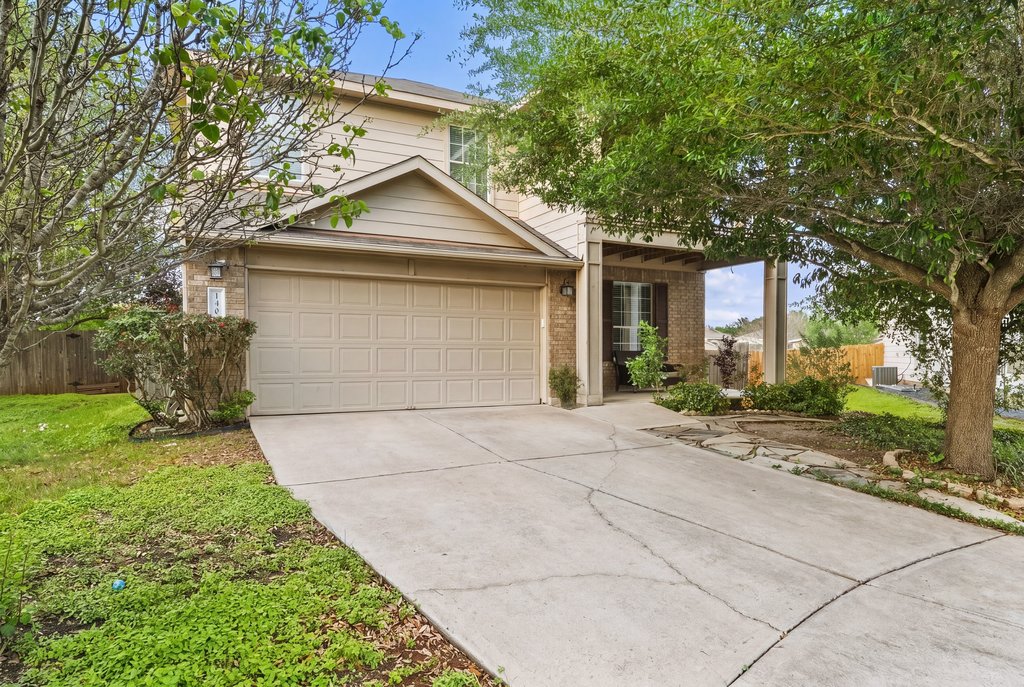 140 Wolfberry Path Buda, TX 78610 - Photo 1 of 35 a front view of house with yard