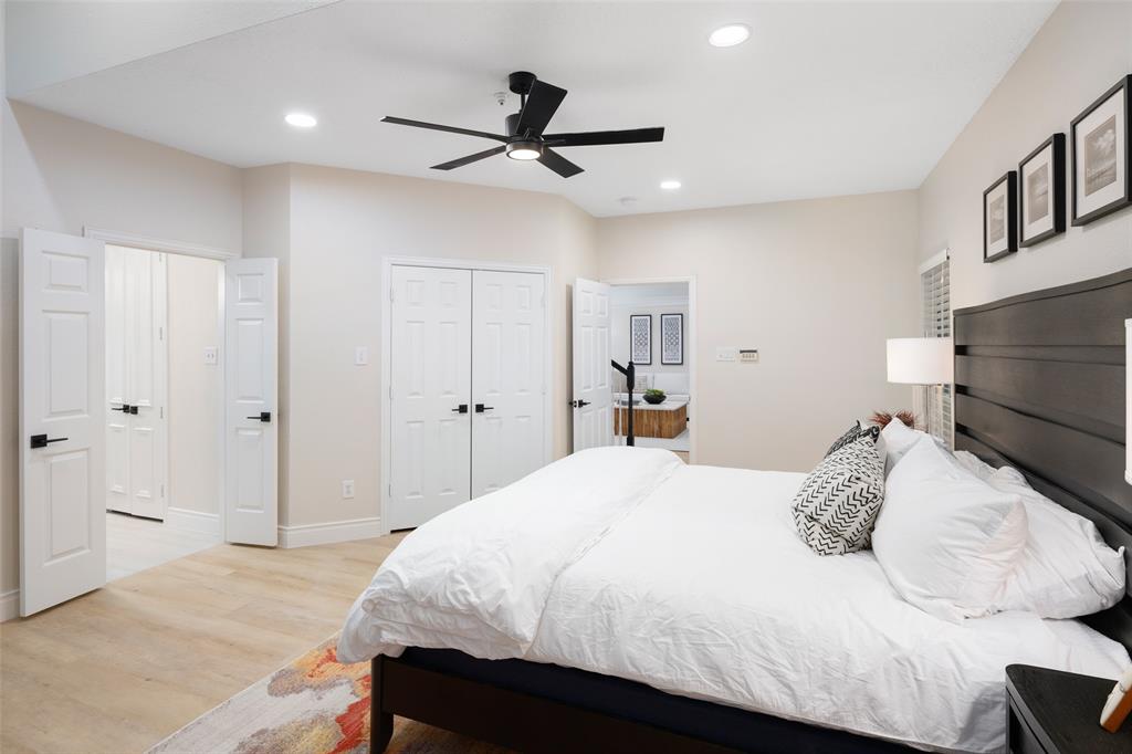 14604 Hemingway Court Addison, TX 75001 - Photo 11 of 27 a bedroom with a bed and a ceiling fan