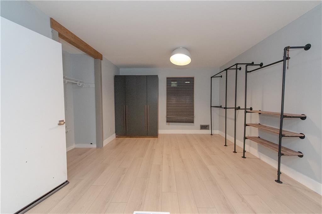 2702 Davenport Road Northwest Duluth, GA 30096 - Photo 22 of 32 a view of empty room with wooden floor