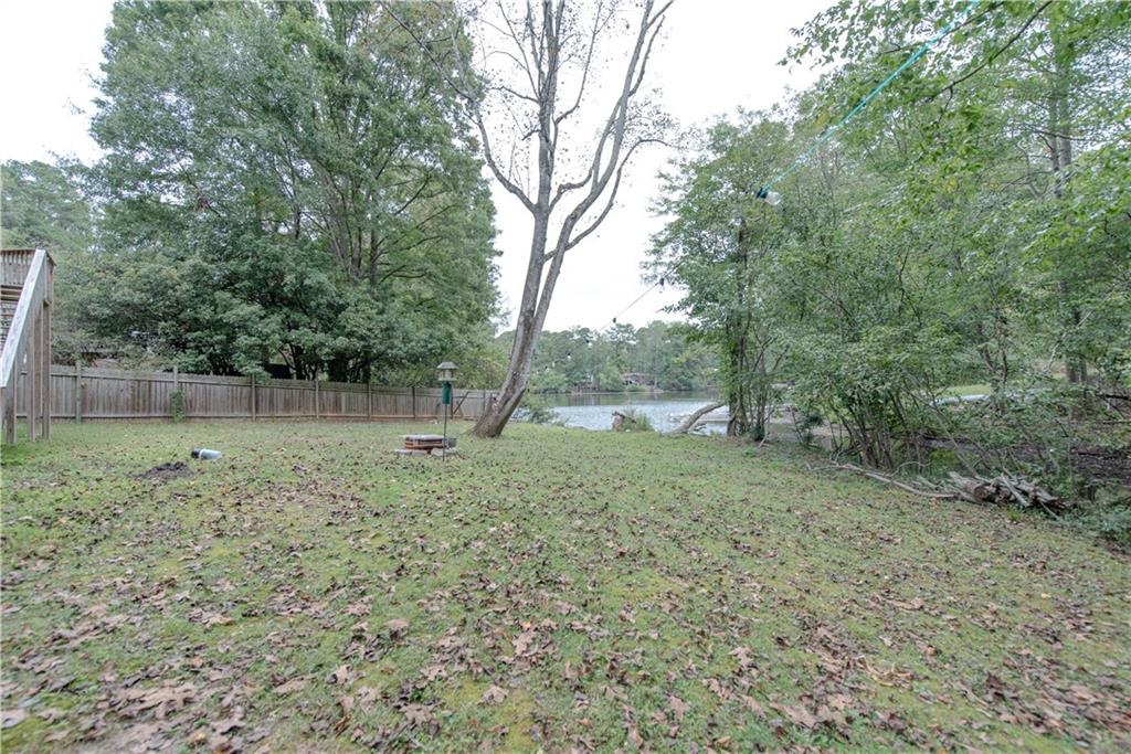 2702 Davenport Road Northwest Duluth, GA 30096 - Photo 32 of 32 a backyard of a house with a trees