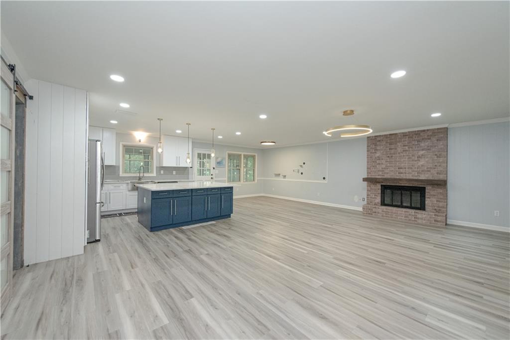 2702 Davenport Road Northwest Duluth, GA 30096 - Photo 6 of 32 a view of kitchen with kitchen island and wooden floor