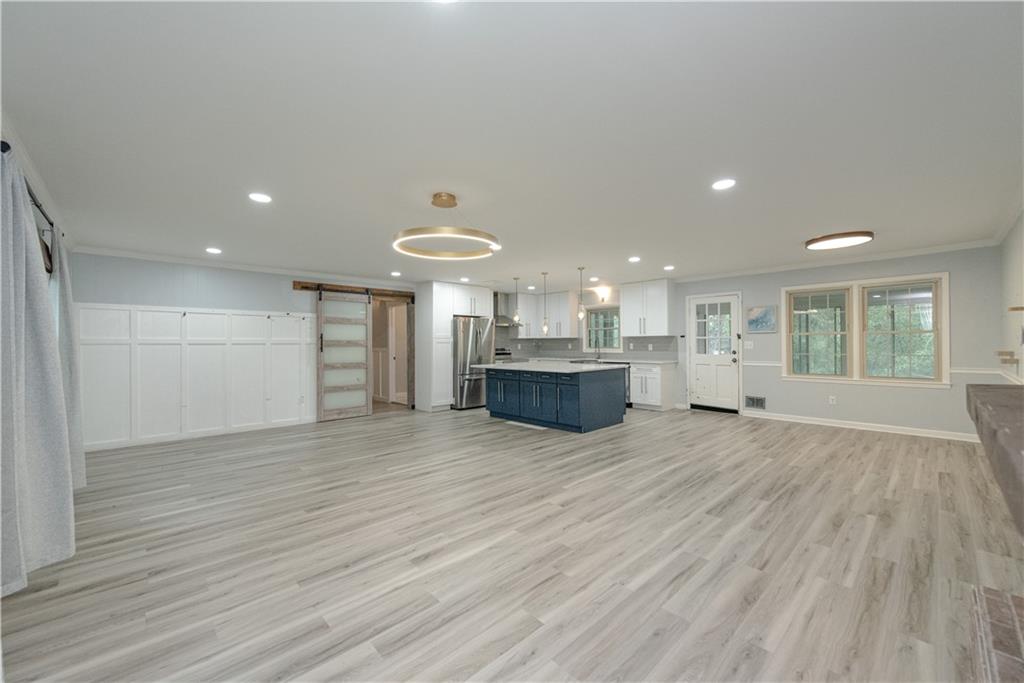 2702 Davenport Road Northwest Duluth, GA 30096 - Photo 7 of 32 a view of kitchen and kitchen with granite countertop wooden floor