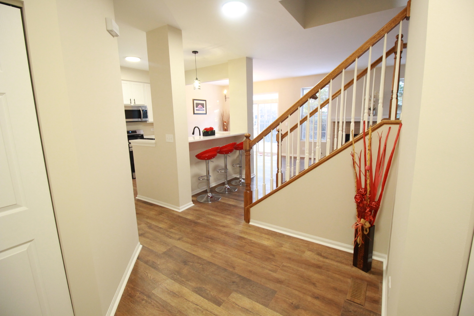 1947 Crestview Circle Romeoville, IL 60446 - Photo 12 of 28 a view of a hallway with wooden floor and staircase