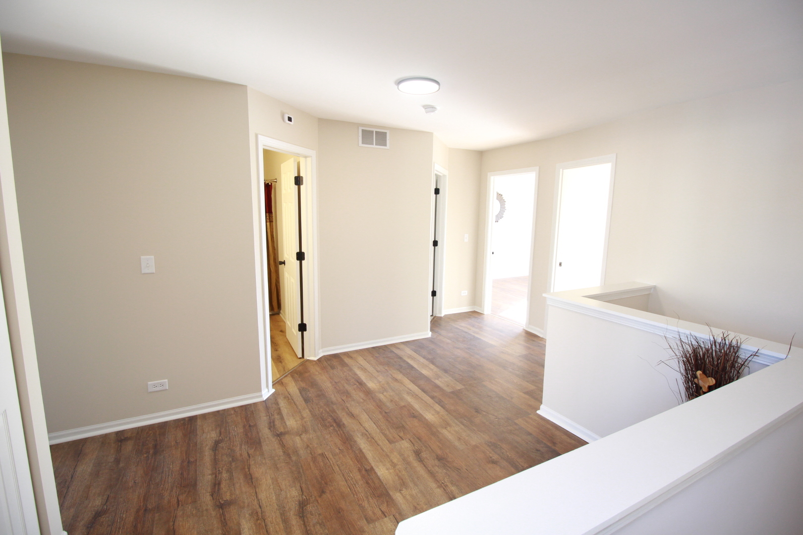 1947 Crestview Circle Romeoville, IL 60446 - Photo 16 of 28 a view of a room with wooden floor and cabinet
