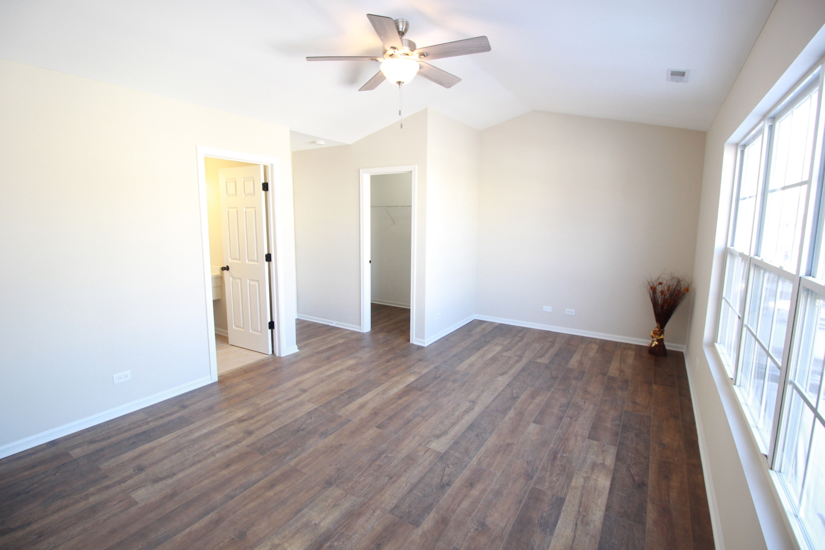 1947 Crestview Circle Romeoville, IL 60446 - Photo 18 of 28 an empty room with wooden floor and windows