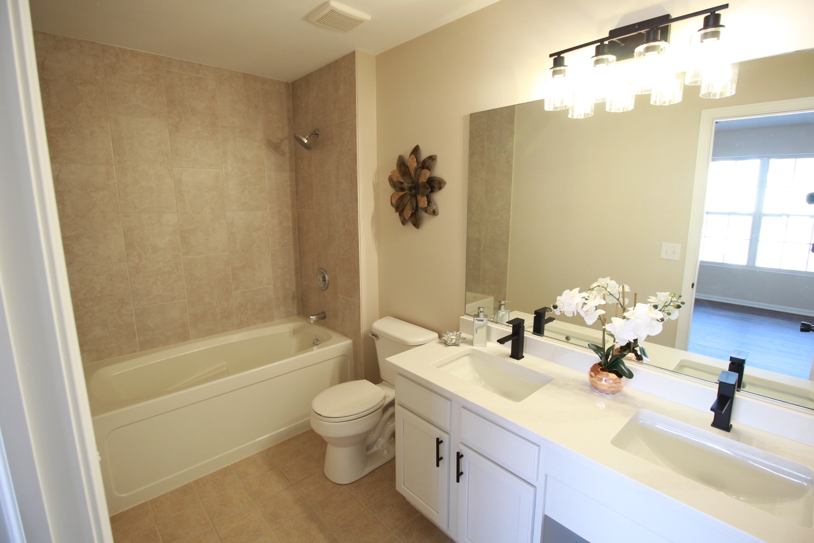 1947 Crestview Circle Romeoville, IL 60446 - Photo 19 of 28 a bathroom with a double vanity sink toilet mirror and shower
