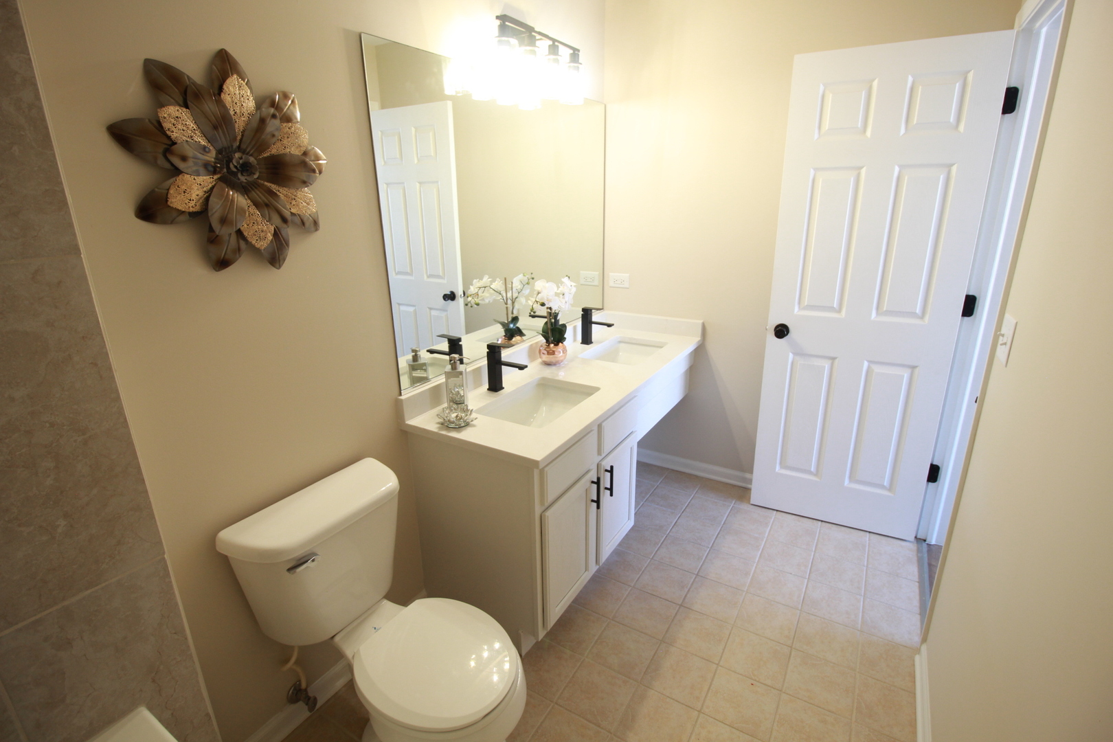 1947 Crestview Circle Romeoville, IL 60446 - Photo 20 of 28 a bathroom with a toilet sink and mirror