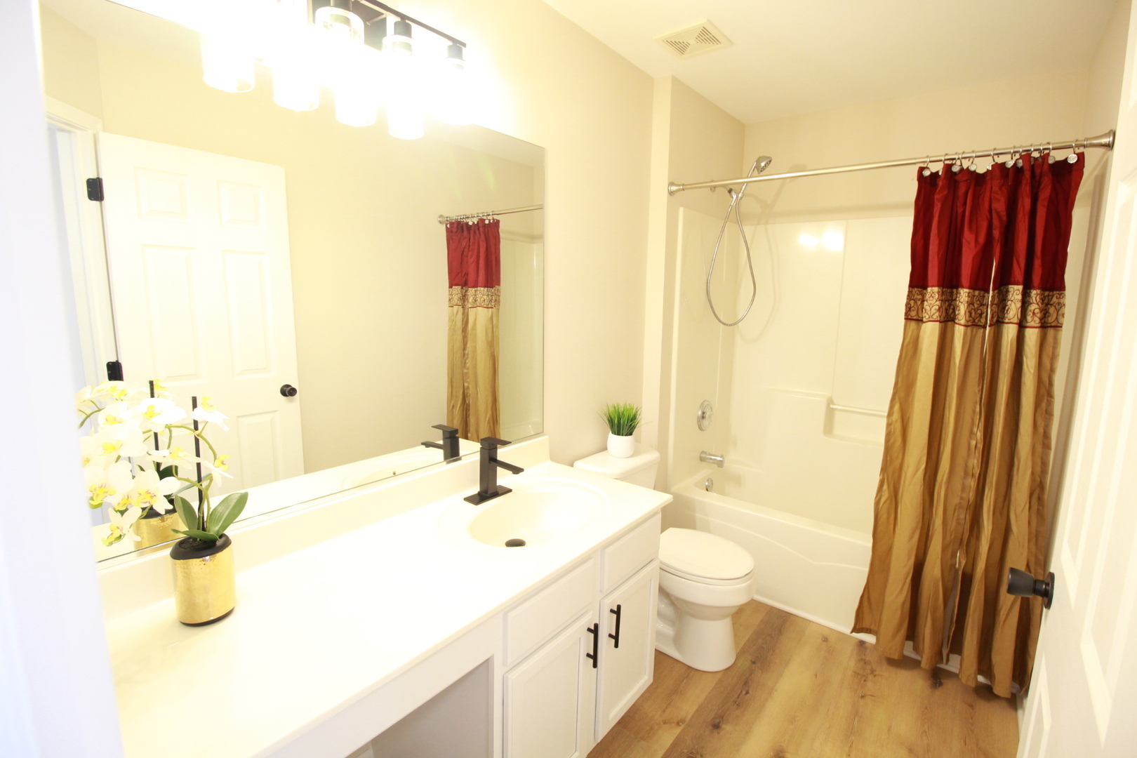 1947 Crestview Circle Romeoville, IL 60446 - Photo 23 of 28 a bathroom with a sink and mirror with toilet