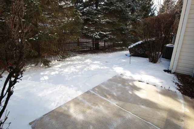 a view of a yard covered in snow