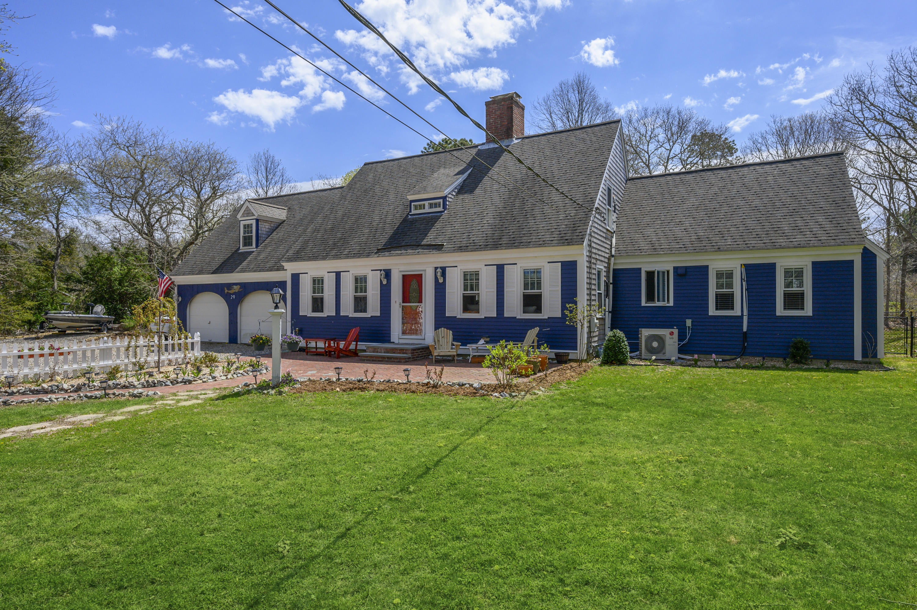 29 Old Kings Road Cotuit, MA 02635 - Photo 2 of 30 a view of a house with a yard and sitting area