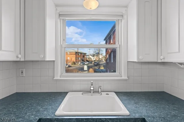 a bathroom with a sink and a window