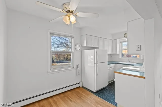 a kitchen with appliances cabinets and a window