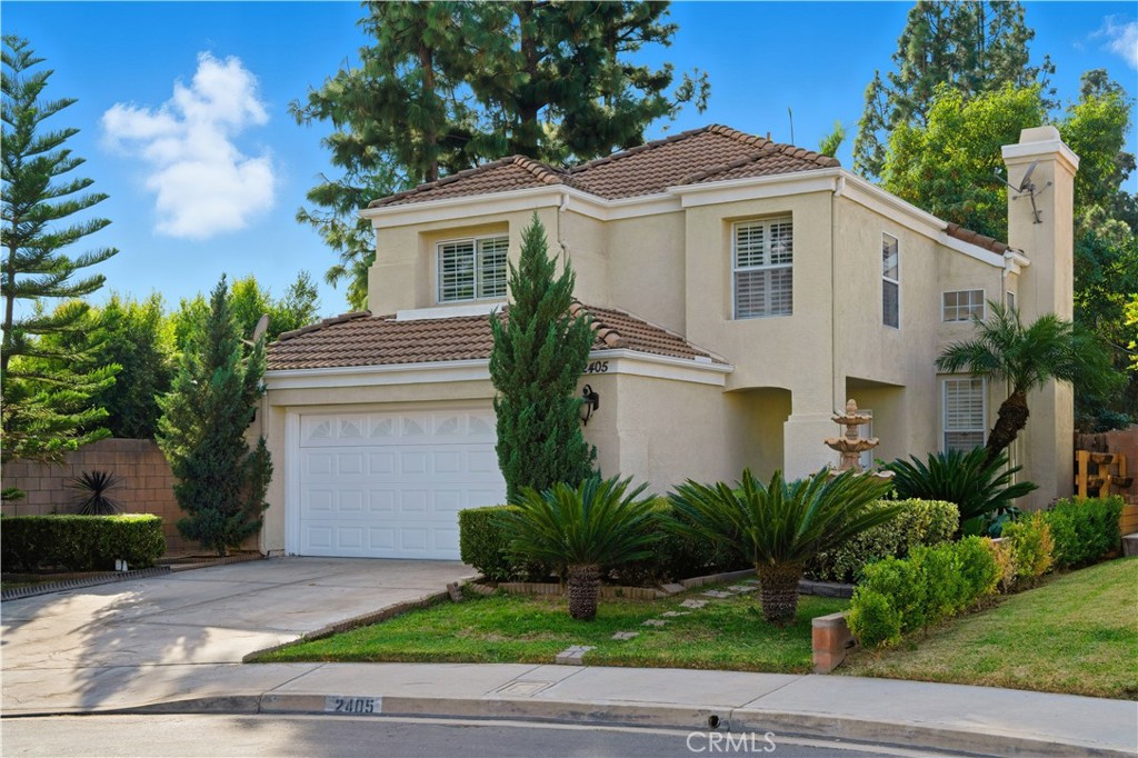 2405 Highland Pines Road Pomona, CA 91767 - Photo 1 of 32 a white house with trees in front of it