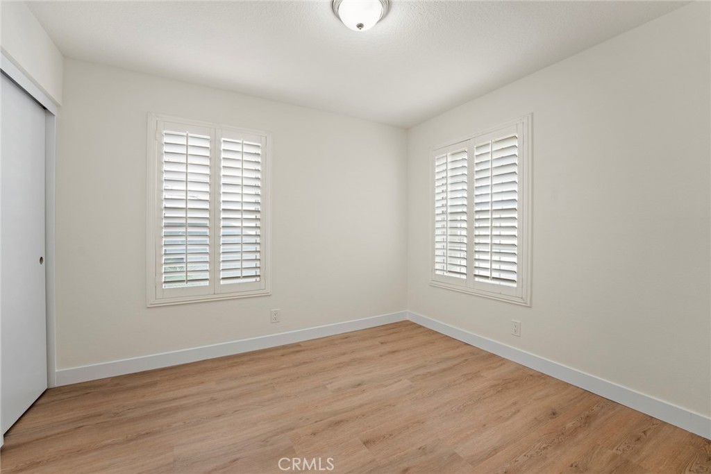 2405 Highland Pines Road Pomona, CA 91767 - Photo 25 of 32 a view of an empty room with wooden floor and a window