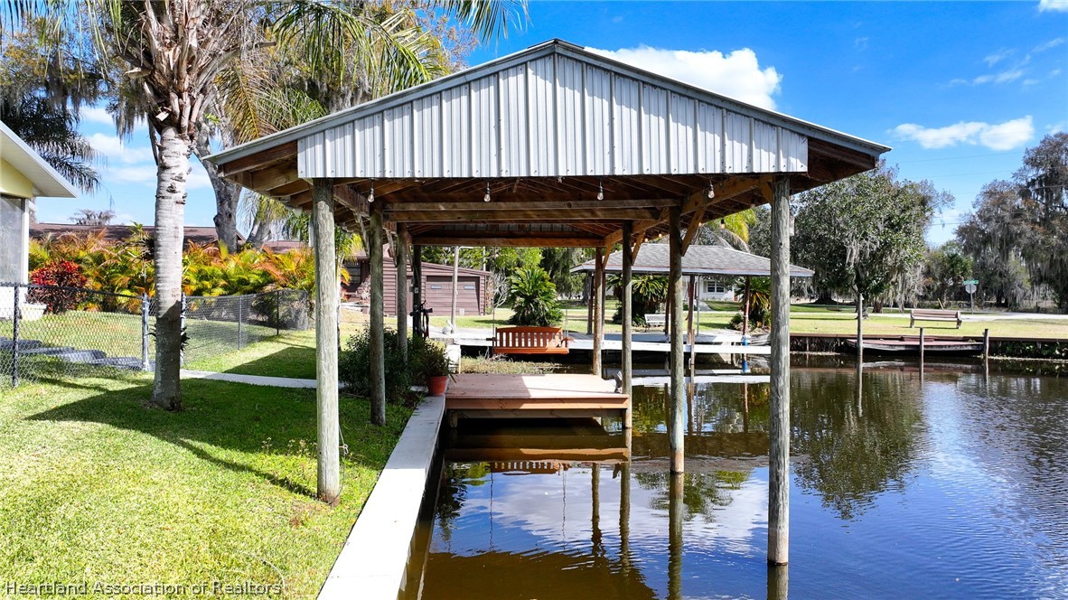 237 Wild Duck Point Lorida, FL 33857 - Photo 14 of 39 a patio with wooden floor table and chairs