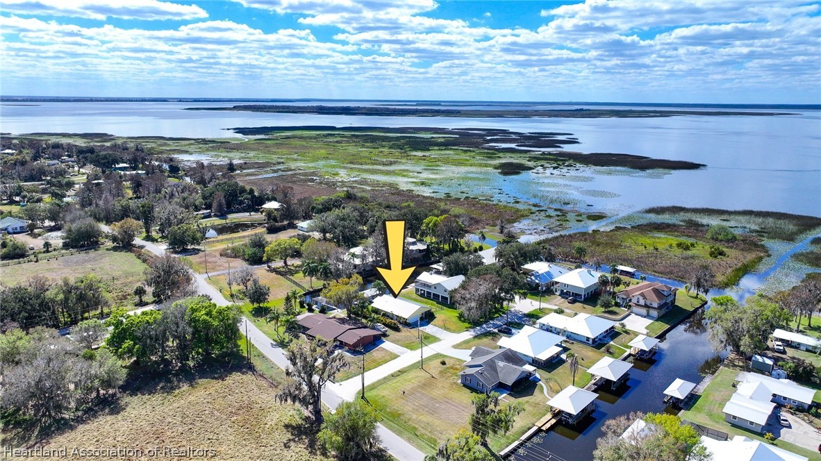 237 Wild Duck Point Lorida, FL 33857 - Photo 2 of 39 a view of a lake with a house