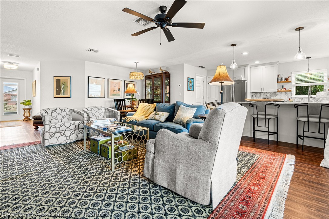 237 Wild Duck Point Lorida, FL 33857 - Photo 26 of 39 a living room with furniture and a large window