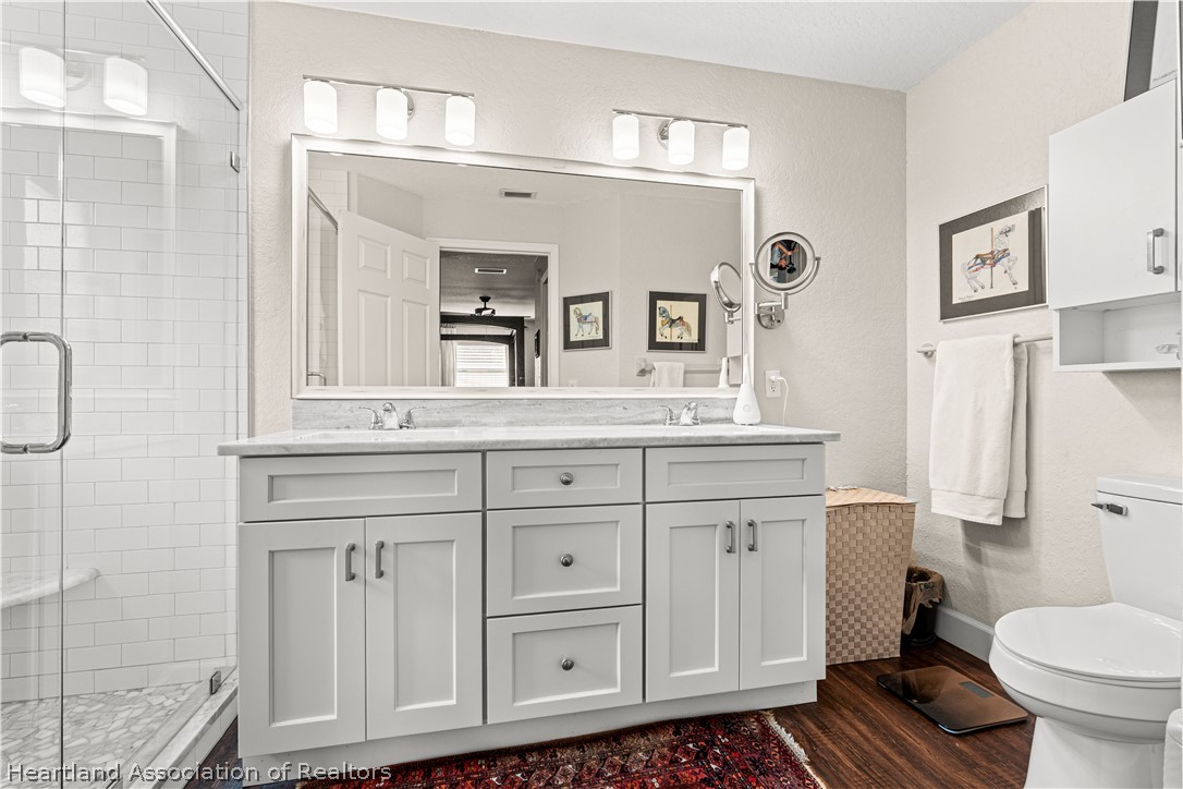 237 Wild Duck Point Lorida, FL 33857 - Photo 31 of 39 a bathroom with a sink toilet and shower