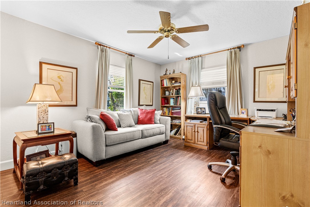 237 Wild Duck Point Lorida, FL 33857 - Photo 33 of 39 a living room with furniture a flat screen tv and a window