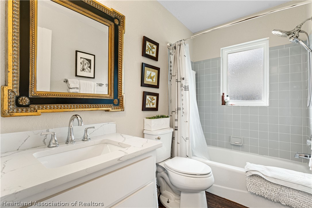 237 Wild Duck Point Lorida, FL 33857 - Photo 34 of 39 a bathroom with a sink toilet and shower