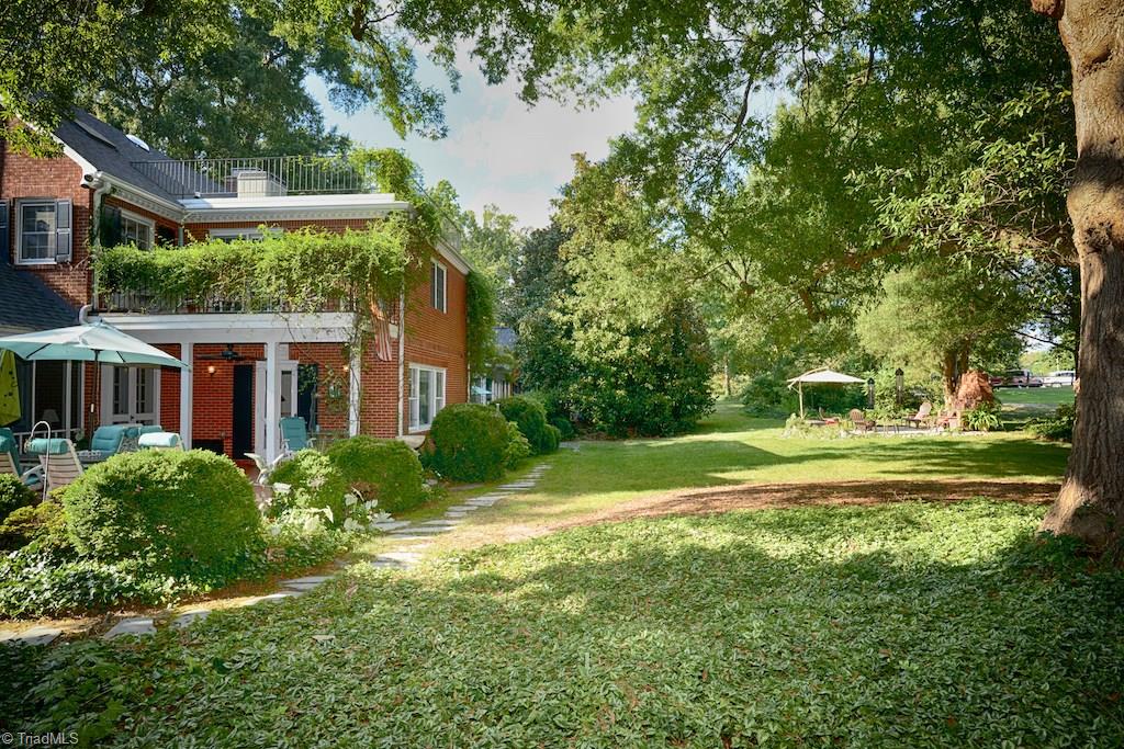 1050 Rockford Road High Point, NC 27262 - Photo 28 of 30 Back Yard is perfect for entertaining with 3 patios, screen porch, and BBQ fireplace