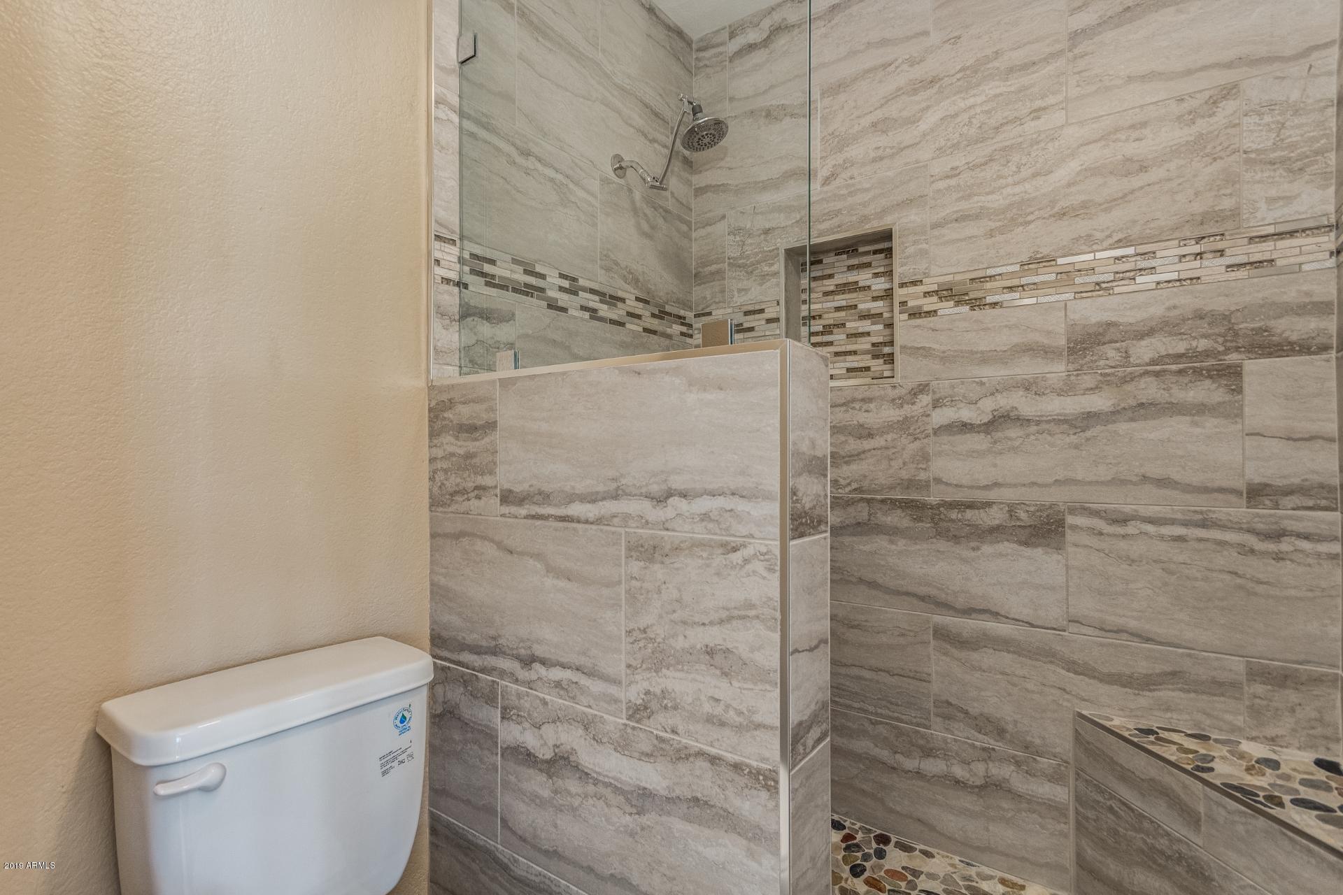 3600 North Hayden Road, Unit 2803 Scottsdale, AZ 85251 - Photo 18 of 22 a bathroom with a toilet and a shower