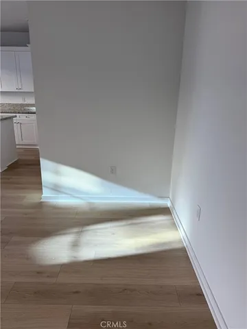 a view of kitchen and wooden floor
