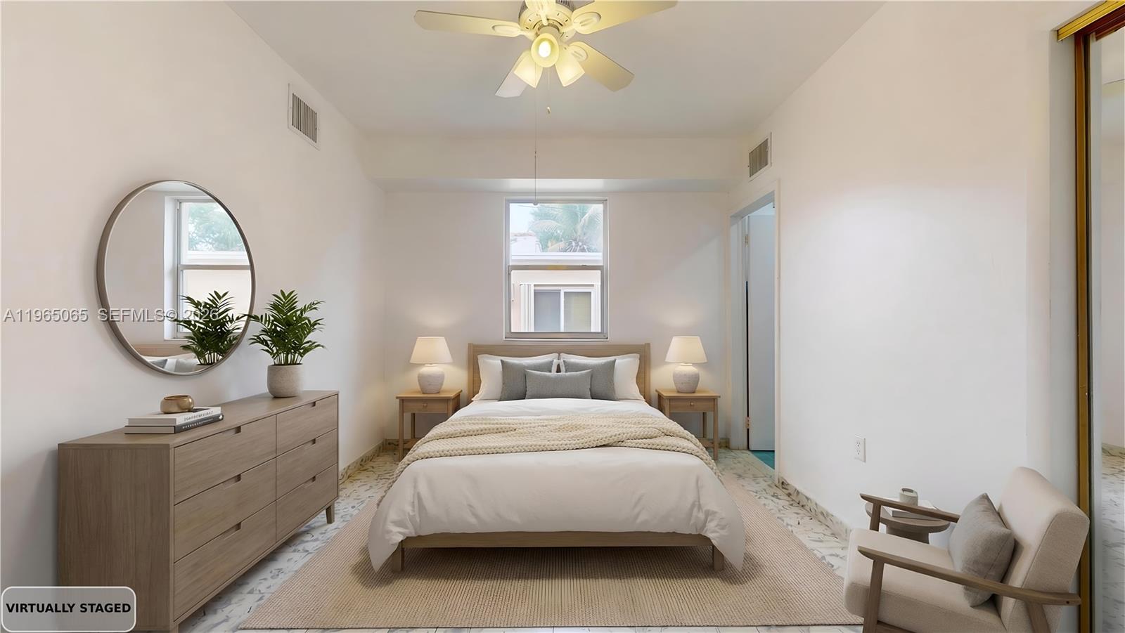 3330 Southwest 2nd Street Miami, FL 33135 - Photo 15 of 28 a bedroom with a bed and a potted plant on the dresser