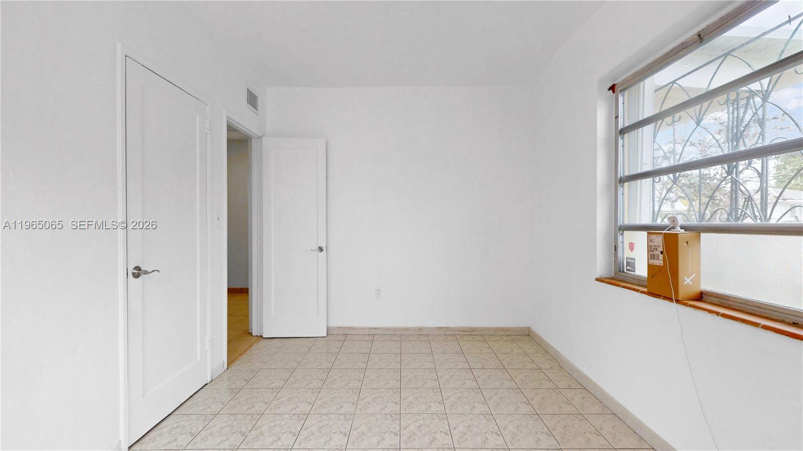 3330 Southwest 2nd Street Miami, FL 33135 - Photo 20 of 28 a view of an empty room with a window