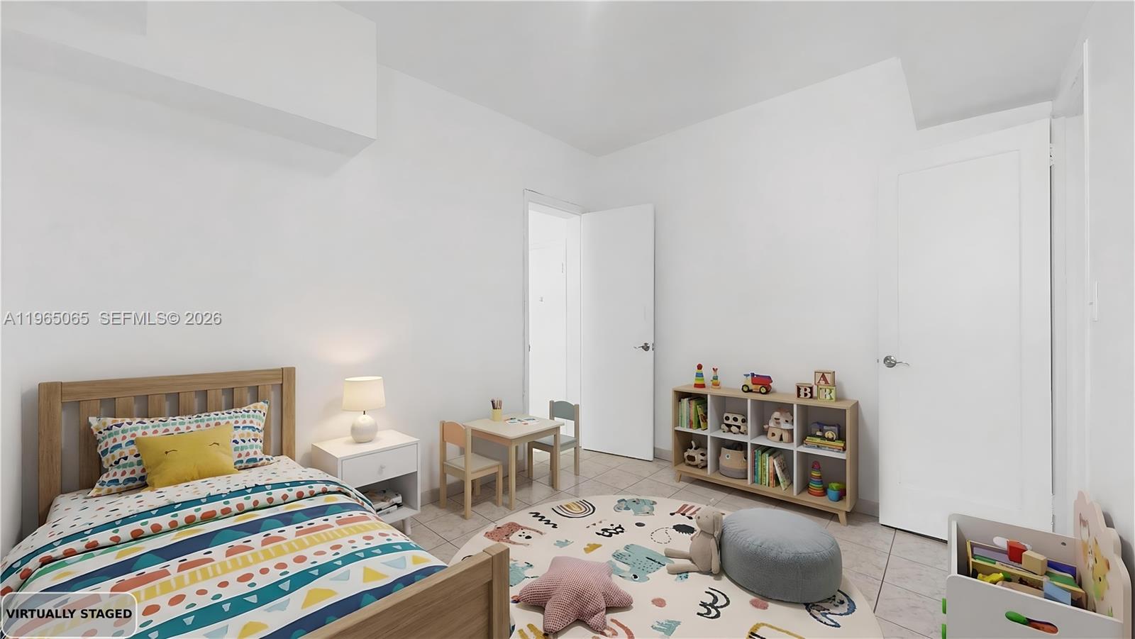 3330 Southwest 2nd Street Miami, FL 33135 - Photo 21 of 28 a bedroom with furniture and a book shelf