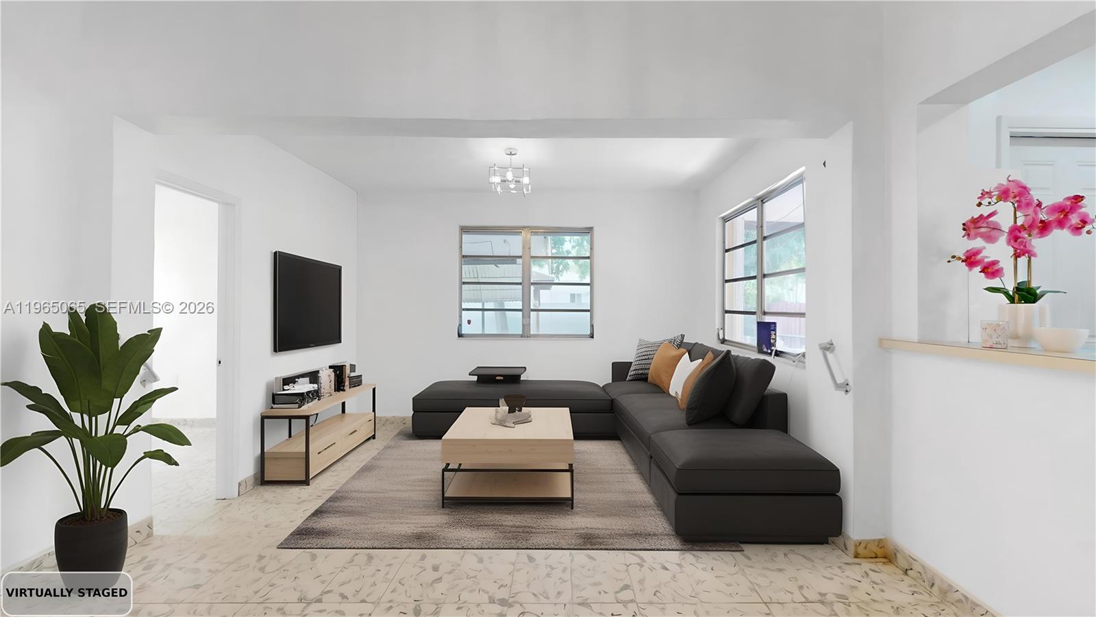 3330 Southwest 2nd Street Miami, FL 33135 - Photo 9 of 28 a living room with furniture and a flat screen tv