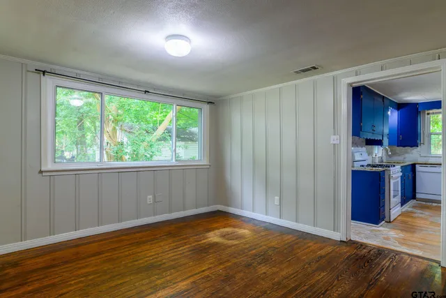 a view of a room with a large window