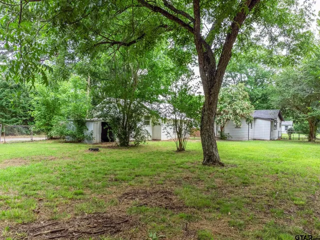 a fire hydrant in the middle of a field