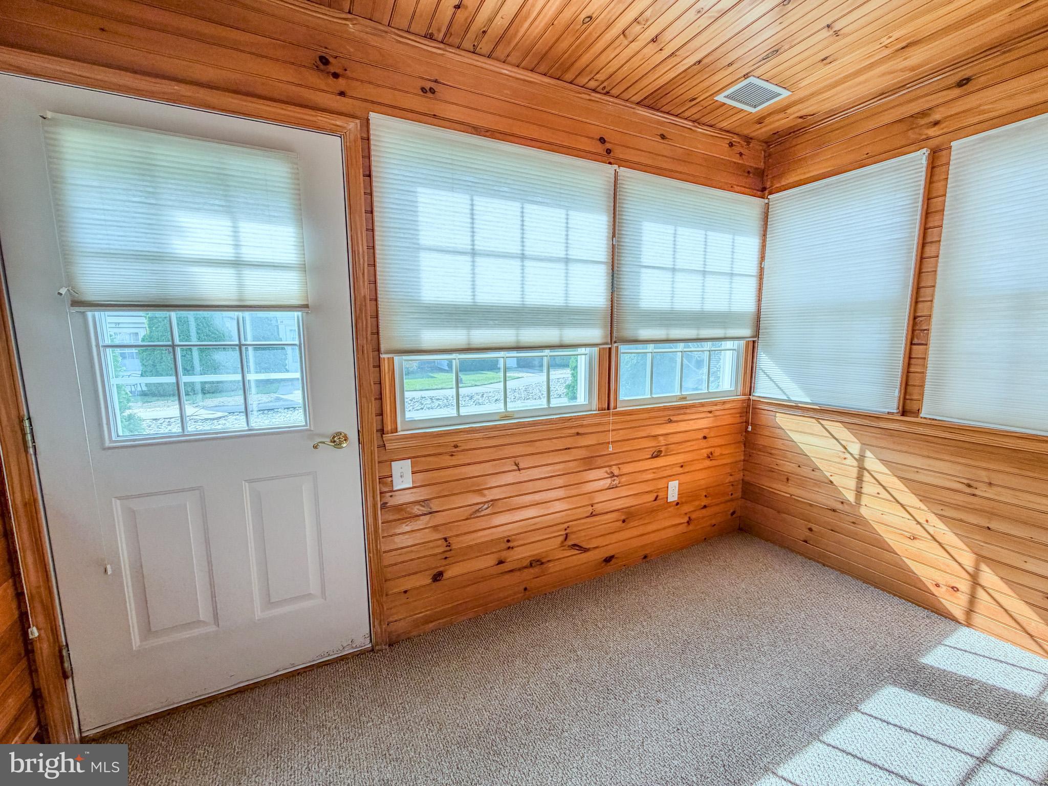 23 East Village Road Newark, DE 19713 - Photo 10 of 11 a view of an empty room with a window