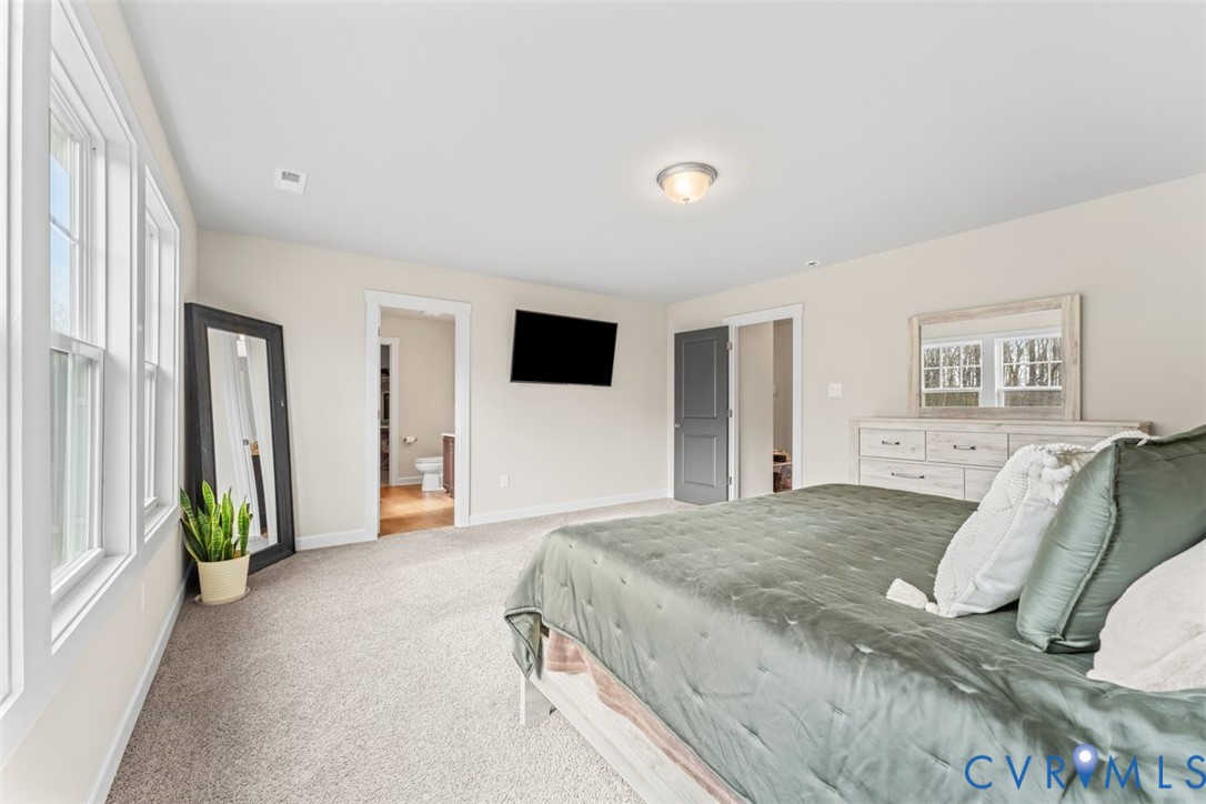 1463 Tutelo Road Quinton, VA 23141 - Photo 17 of 31 a spacious bedroom with a bed and a window
