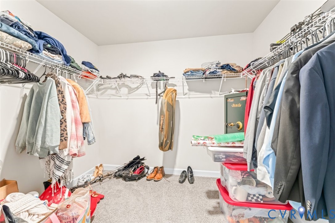1463 Tutelo Road Quinton, VA 23141 - Photo 19 of 31 a view of walk in closet with clothes and shoes