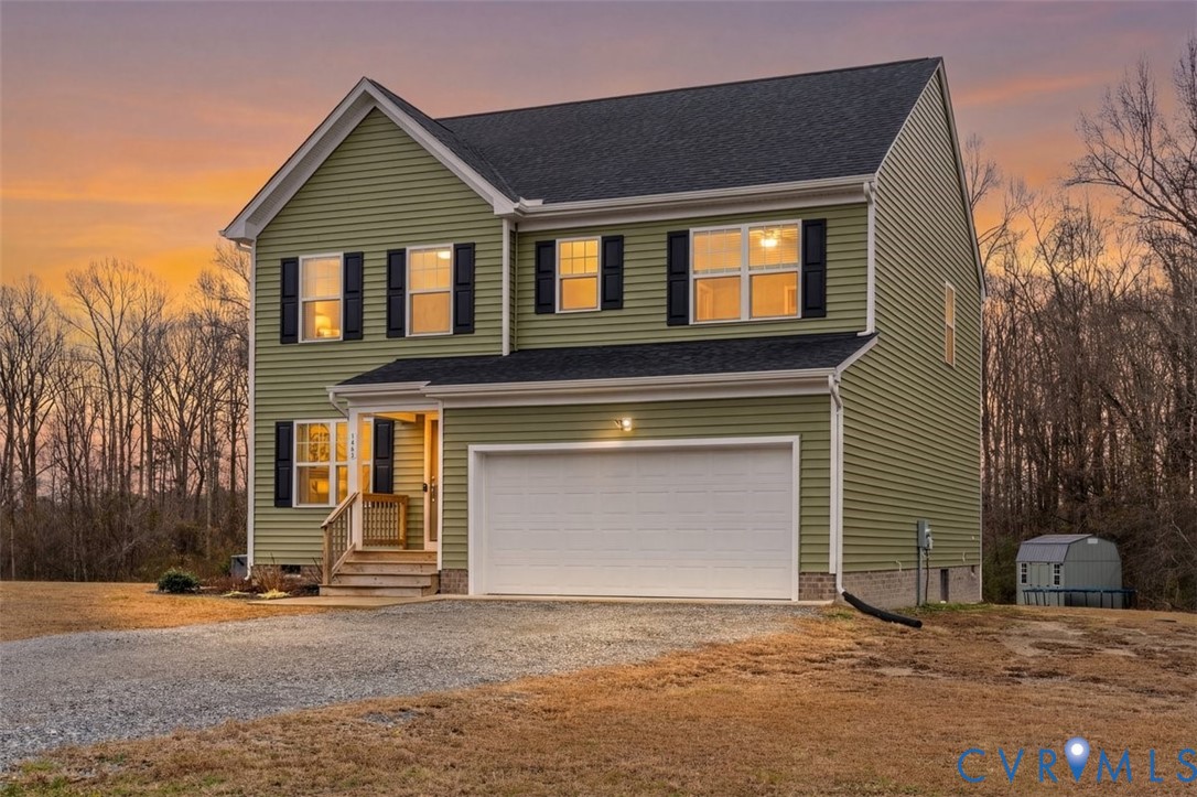 1463 Tutelo Road Quinton, VA 23141 - Photo 5 of 31 a front view of a house with a yard and garage