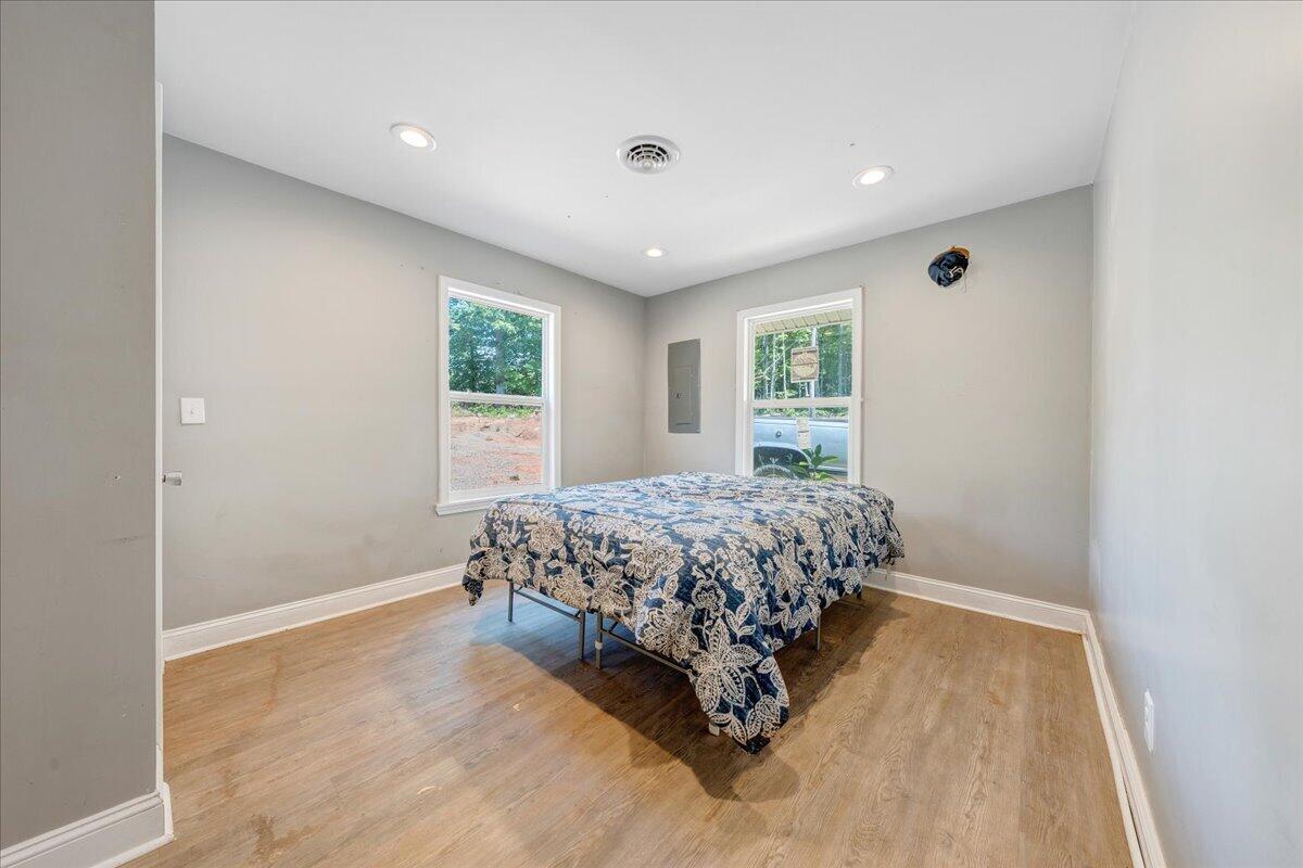 6379 Fork Mountain Road Rocky Mount, VA 24151 - Photo 5 of 9 a bedroom with a bed and a window