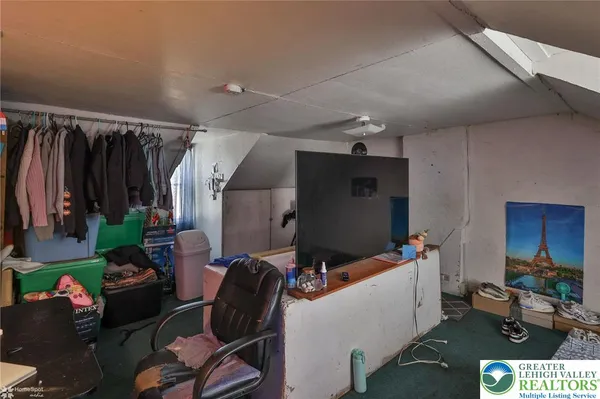 a room with furniture and gym equipment