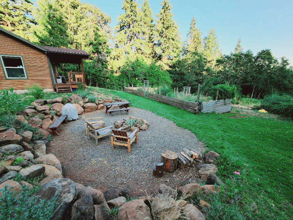 23 Wnuk Road White Salmon, WA 98672 - Photo 2 of 25 a view of a backyard with sitting area and garden