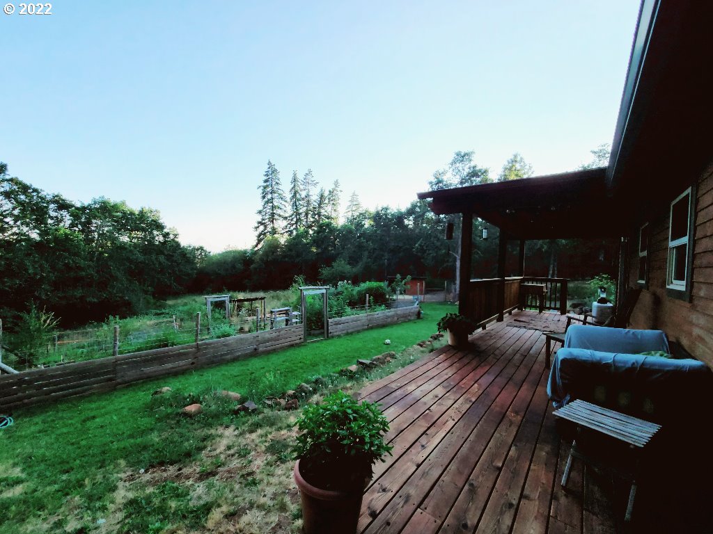 23 Wnuk Road White Salmon, WA 98672 - Photo 23 of 25 a view of a deck with couches table and chairs and potted plants