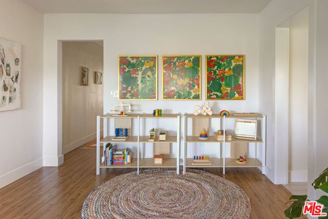 a bedroom with furniture and large window